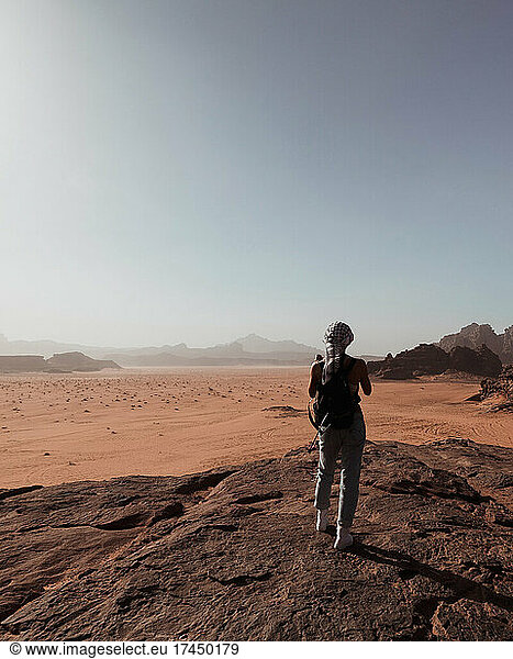 Girl looking at desert in Wadi Rum