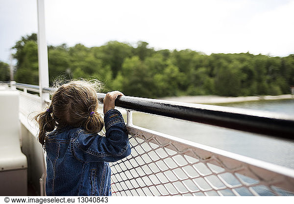 Girl looking through railing at Washington Island Ferry