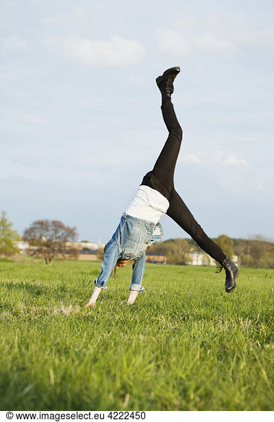 Girl makes a cartwheel
