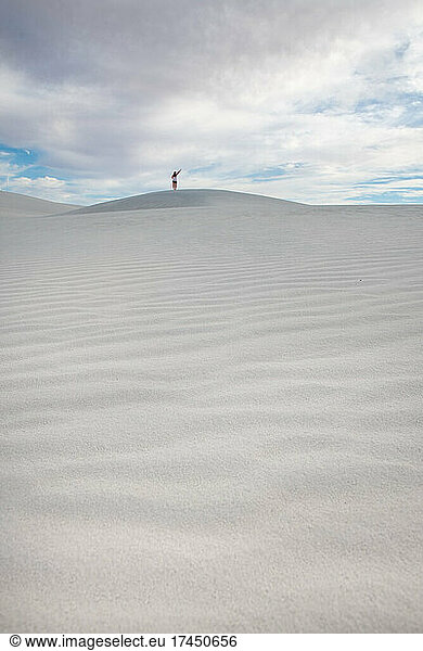 Girl On Top Of Huge Sand Dune In White Sands National Park  New Mexico