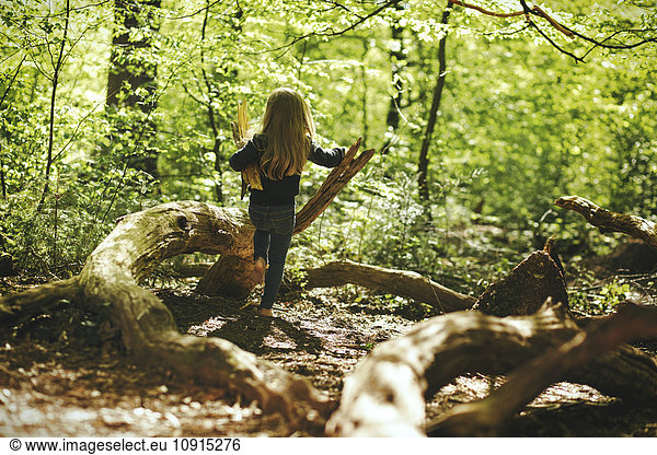 Girl playing in forest
