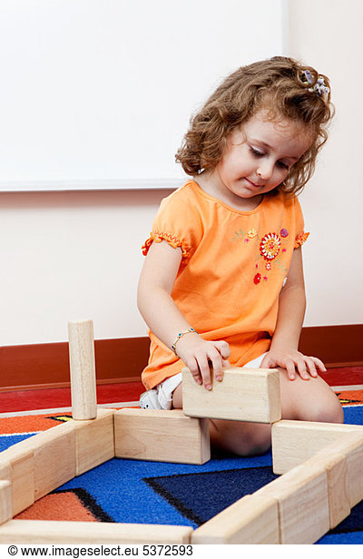 Girl playing with building blocks