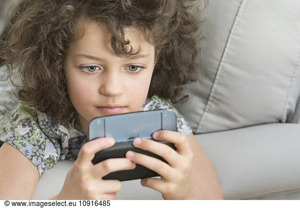 Girl playing with mobile device