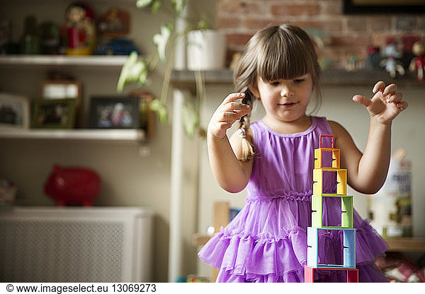 Girl playing with toys at home