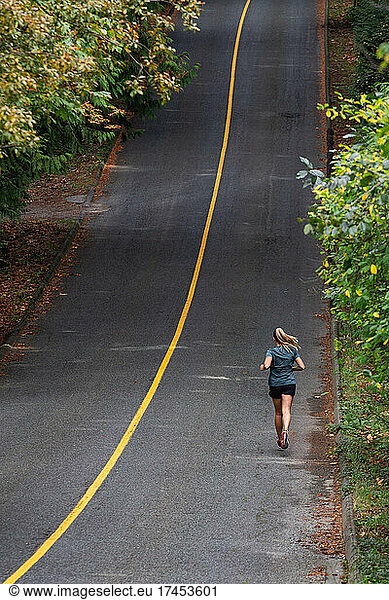 Girl Road Running Up Hill