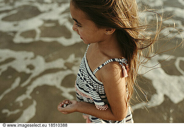 Girl Standing in Ocean with Shells Close up Corpus Christi Texas