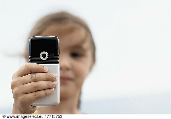 Girl Using Cell Phone On Woodbine Beach  Toronto  Ontario