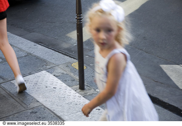 Girl walking on street  blurred motion