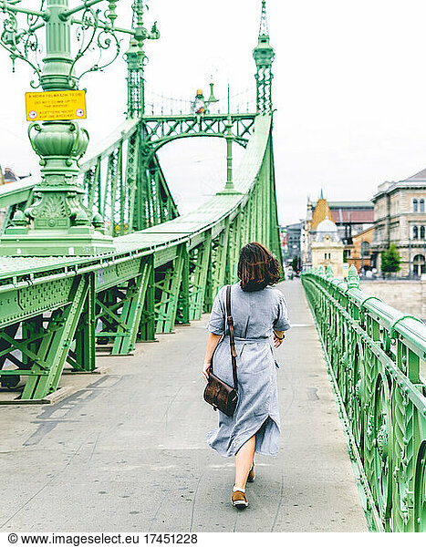 Girl walking on the Liberty Bridge Budapest