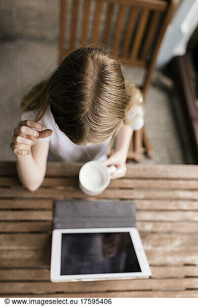 Girl watching tablet computer on tablet