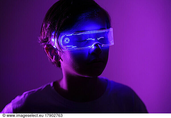 Girl with eyes closed wearing smart glasses experiencing metaverse