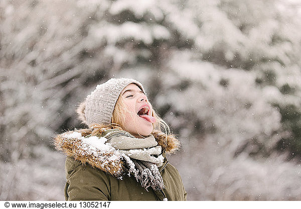 Girl with mouth open waiting for snow