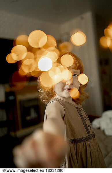 Girl with sparkler at home