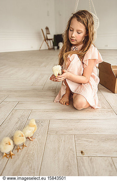 girls playing with ducks for Easter