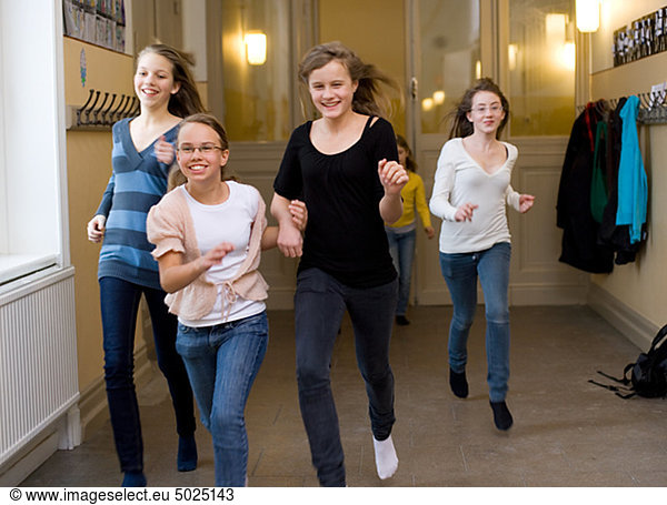 Girls running in corridor during break