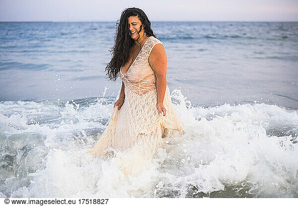 Glam Dusky Portrait of Brunette Woman at beach