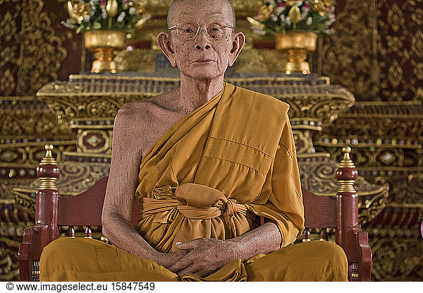 Glass fiber`s statue monk in the Wat Phra Sing temple
