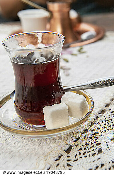glass of Bosnian tea at street cafe