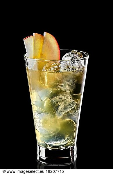 Glass of cold water with ice cubes and apple syrup isolated on black background