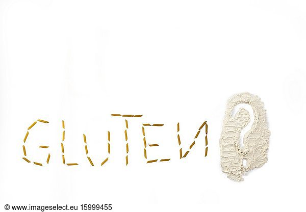 Gluten word made with pasta penne isolated on white background healthy.