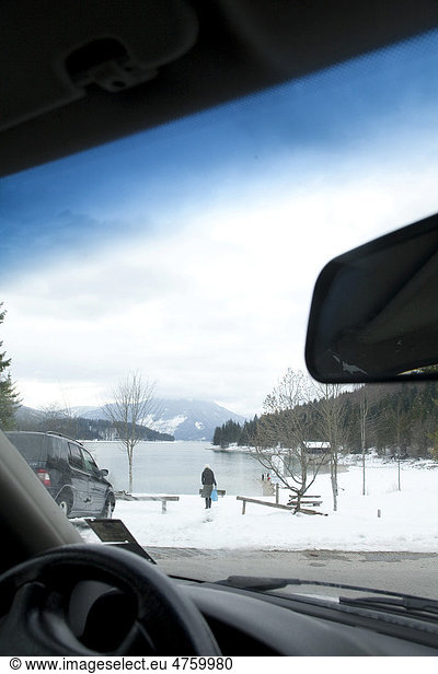 Going on winter holiday by car  lakeshore of Walchensee or Lake Walchen  Bavaria  Germany  Europe