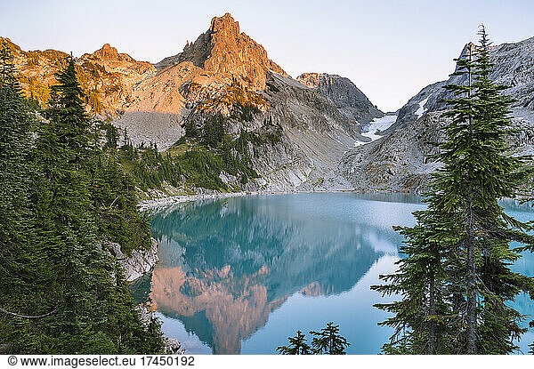 Gorgeous Blue Alpine Lake At Sunset With Glacier Carved Valley