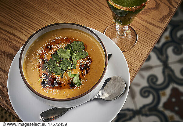 Gourmet latin inspired soup with a craft cocktail.