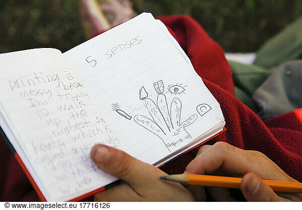 Grade Three Student Taking Field Notes During School Outing  Keats Island  British Columbia