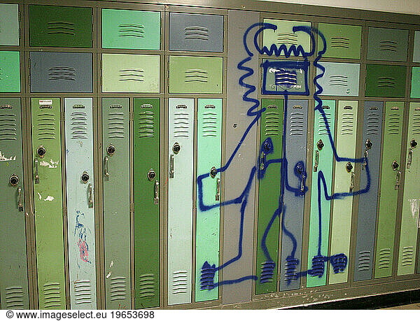 Graffiti is drawn on a row of lockers in an unspecified school in a Newark  New Jersey.