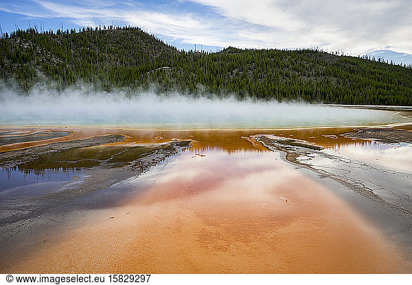 Grand Prismatic Spring with orange run-off channels and hot steam