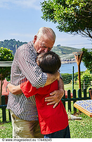 Grandson Hugs His Beloved Grandfather