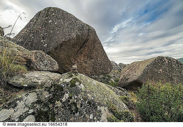 Granite rocks and milestone at The Pedriza Regional Park. Madrid. Spain. Europe.
