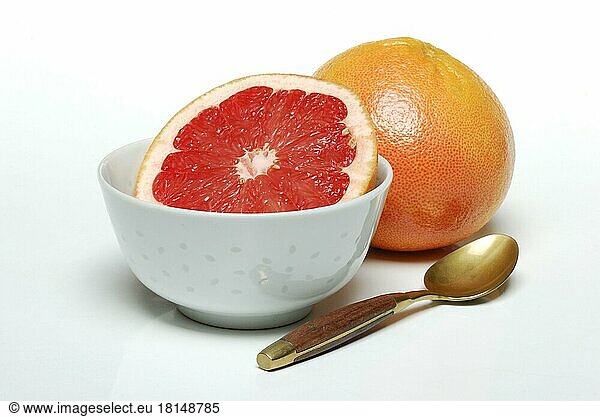 Grapefruit and spoon ( Citrus maxima  Citrus x paradisi)