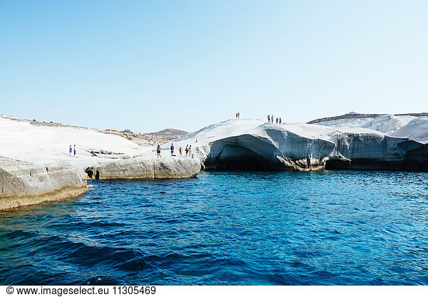Greece,  Milos,  People on the white rocks in Sarakiniko