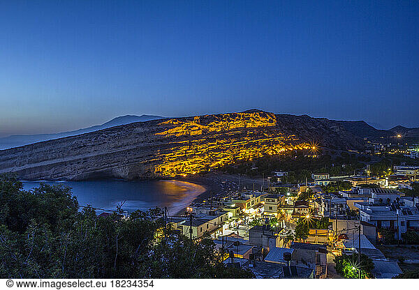 Greece  Crete  Matala  View of illuminated coastal village at night