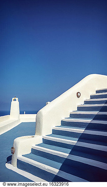 Greece  Cyclades  Santorini  Oia  typical staircase and terrace in front of blue sky