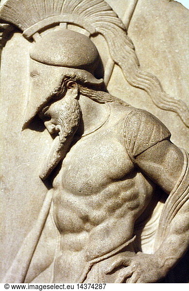 Greek warrior. Hellenistic  1st century BC From Rhodes This marble grave relief shoes a warrior dressed in a cuirass and helmet leaning on his spear in front of a funerary stele. The serpent at the base symbolises the soul of the deceased. The relief is "archaising" and imitates Greek sculpture of the mid 5th century BC.