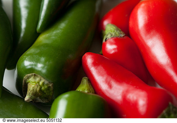 Green and red chilli peppers  full frame