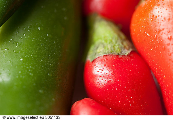 Green and red chilli peppers  full frame
