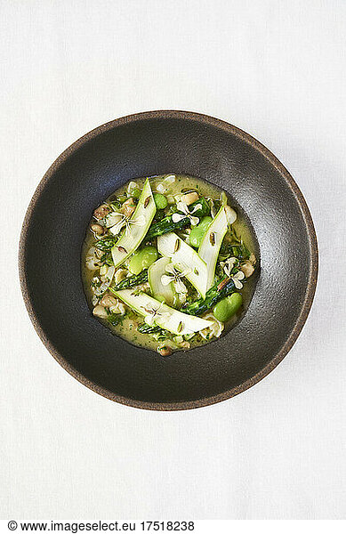Green Fresh Asparagus dish in a beautiful ceramic bowl at a restaurant