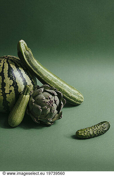 Green fruits and vegetables against green background