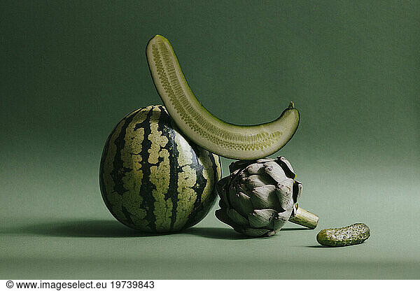 Green fruits and vegetables against green background