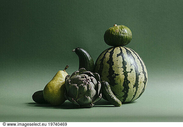 Green fruits and vegetables against green background