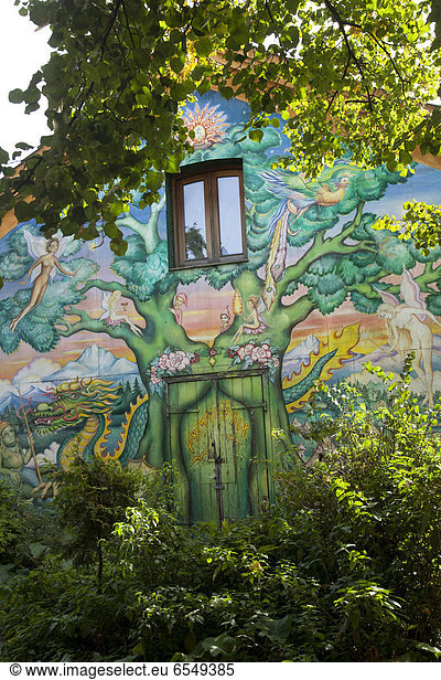 Green mural on house wall