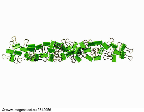 Green Office Supplies. Paperclips on a white background.