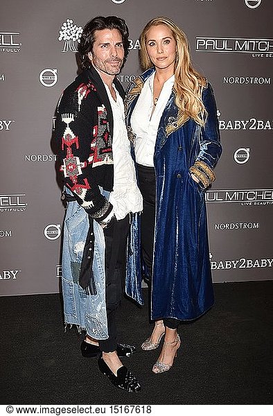 Greg Lauren (L) and Elizabeth Berkley arrive at the The 2018 Baby2Baby Gala Presented By Paul Mitchell Event at 3LABS on November 10  2018 in Culver City  California.