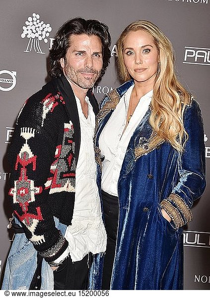 Greg Lauren (L) and Elizabeth Berkley arrive at the The 2018 Baby2Baby Gala Presented By Paul Mitchell Event at 3LABS on November 10 2018 in Culver City California.