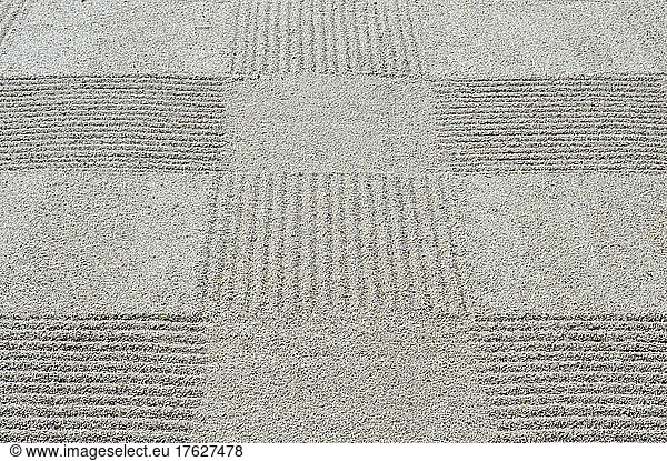 Grid pattern of raked gravel at a temple
