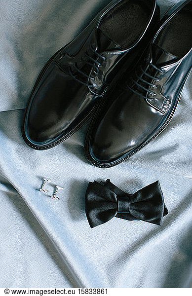 Groom accessories. Shoes  bow tie  and cufflinks.