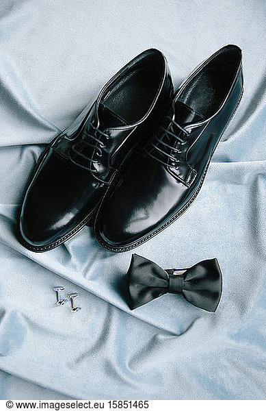 Groom accessories. Shoes  bow tie  and cufflinks.